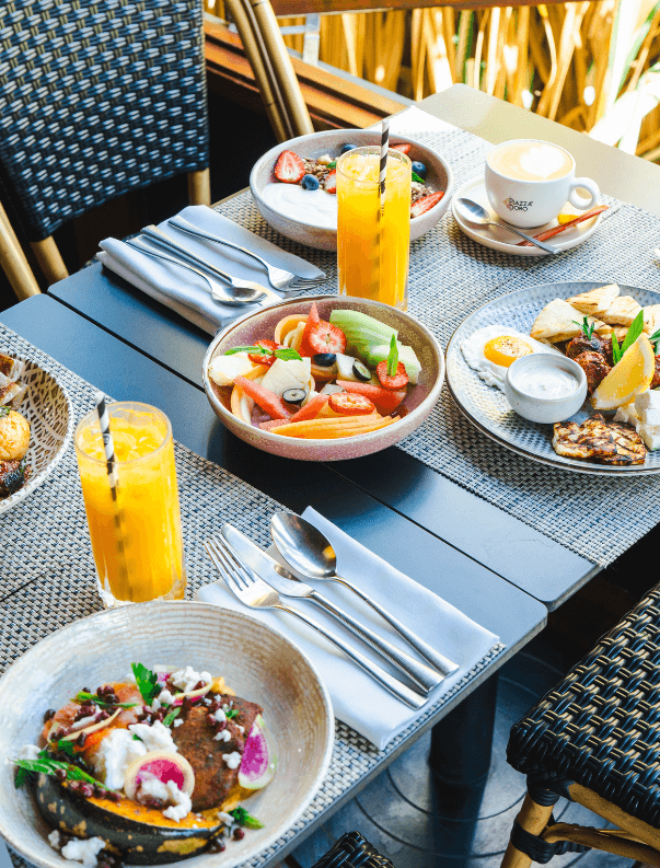 Outdoor breakfast table with dishes